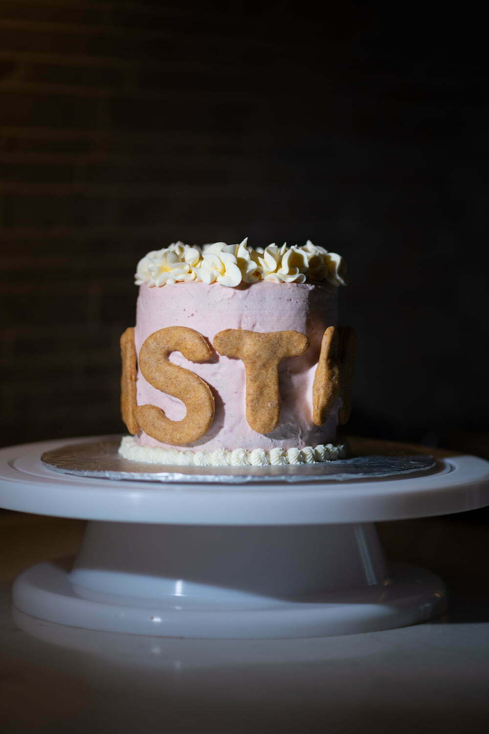 Simple ruffle cake with cookies name