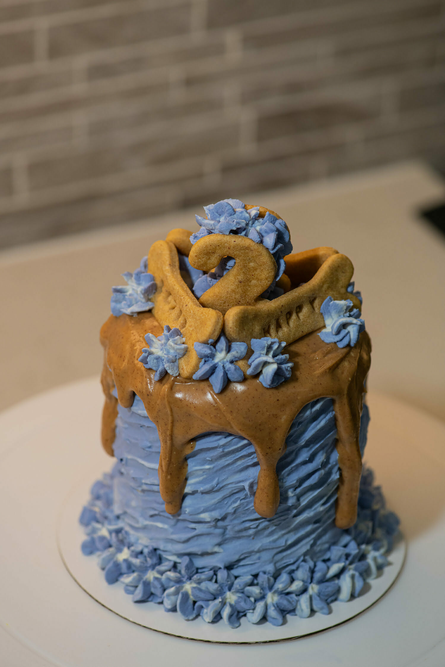 Strokes cake with cookies and peanut butter drip
